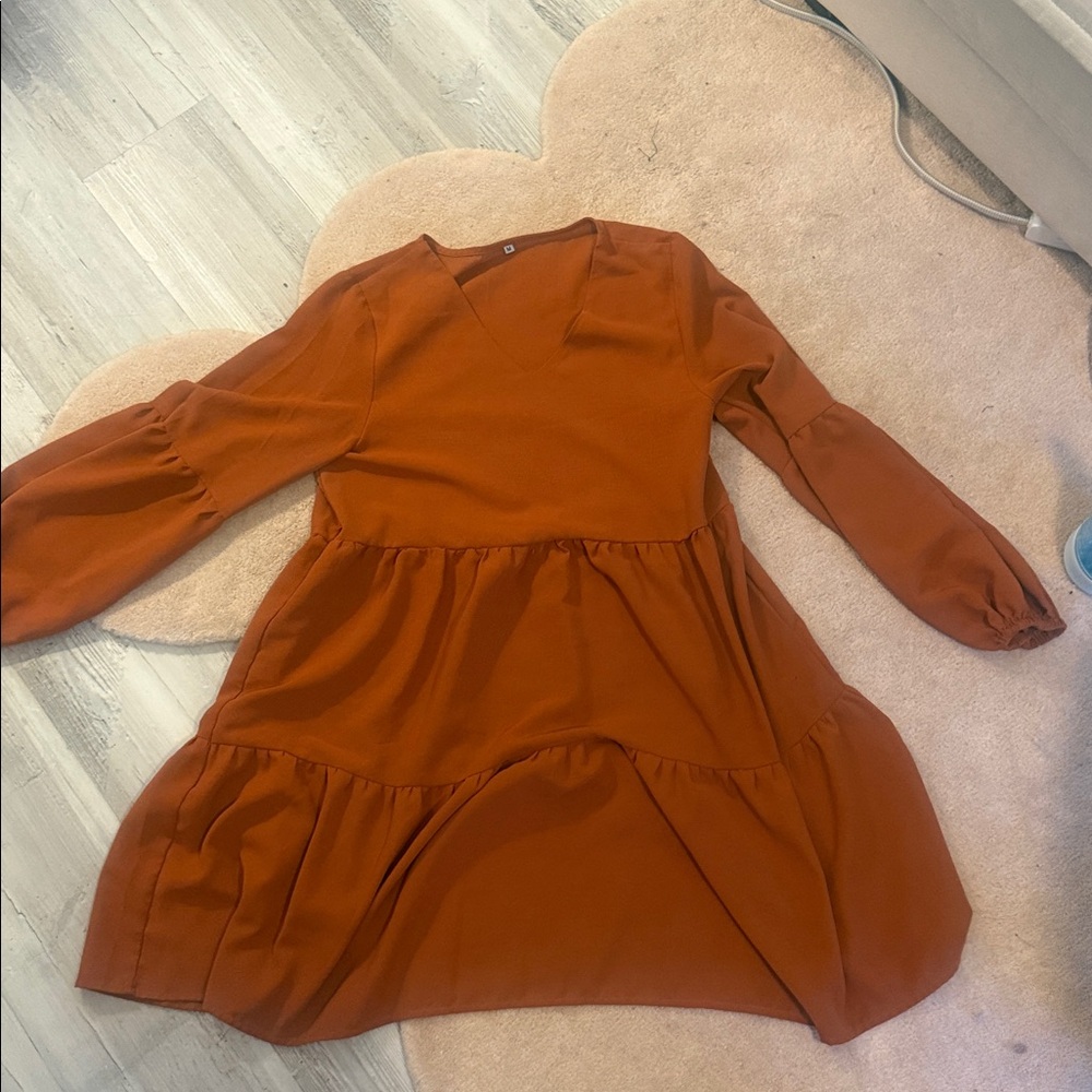 That orange tiered ruffle dress